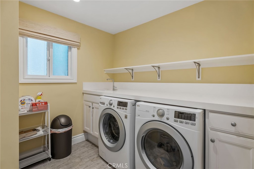 4403 Seashore Drive Newport Beach, CA 92663 - Photo 29 of 69 a utility room with dryer and washer