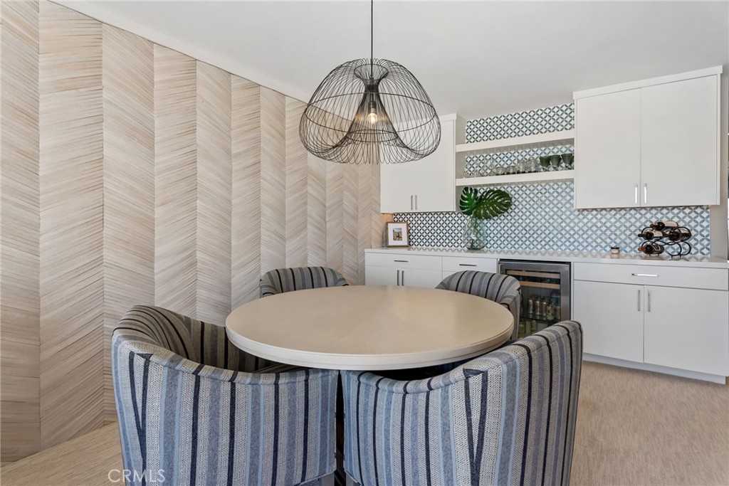 4403 Seashore Drive Newport Beach, CA 92663 - Photo 42 of 69 a bathroom with a sink a mirror a lamp and a window