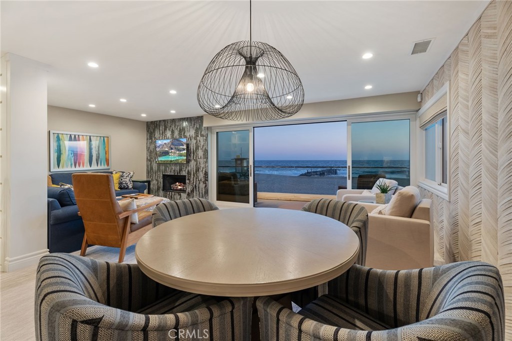 4403 Seashore Drive Newport Beach, CA 92663 - Photo 63 of 69 a living room with furniture a chandelier and a large window