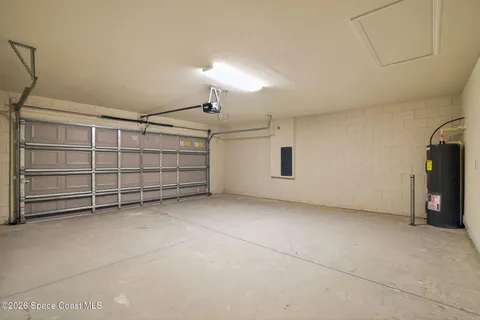 a view of an empty room with a fireplace
