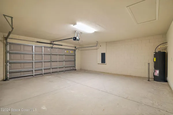 a view of an empty room with a fireplace