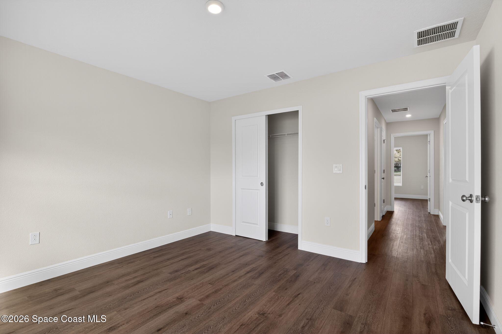5294 Southeast 91st Street Ocala, FL 34480 - Photo 10 of 15 a view of a room with wooden floor and brick walls