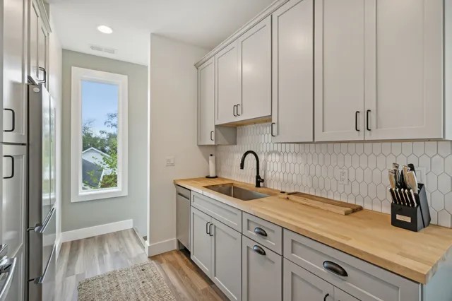 a kitchen with a sink and cabinets