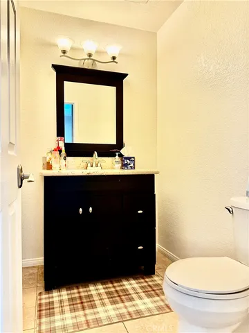 a dining room with wooden floor and stairs