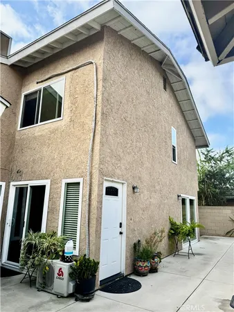 a house view with a garden space