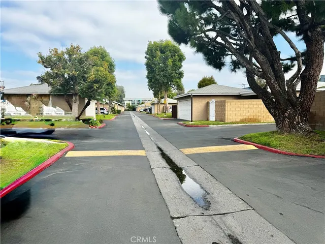a view of a backyard with swimming pool