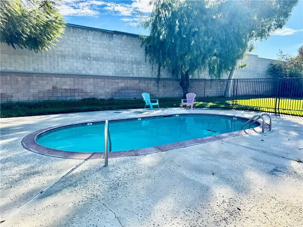 a view of a backyard with a fence