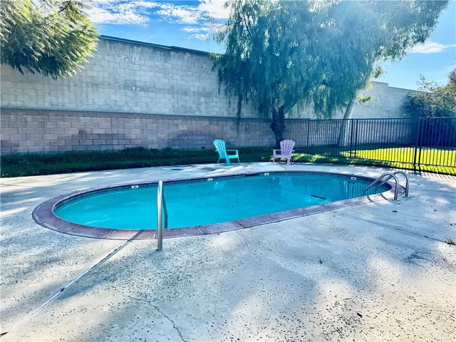 a view of a backyard with a fence