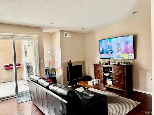 a kitchen with stainless steel appliances granite countertop a refrigerator sink stove and microwave