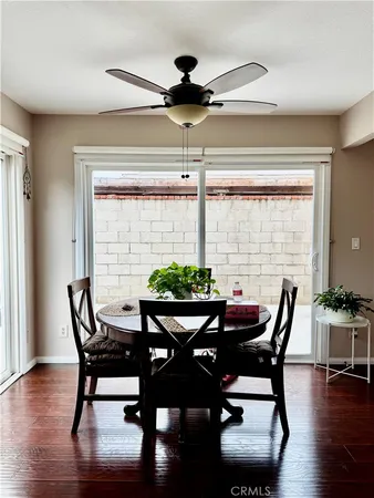 a bathroom with a toilet sink vanity and mirror