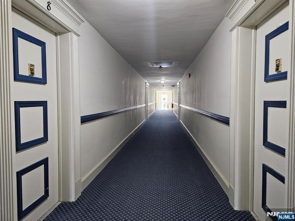 605 Grove Street, Unit F8 Clifton, NJ 07013 - Photo 13 of 15 a view of hallway with stairs