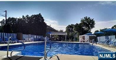 605 Grove Street, Unit F8 Clifton, NJ 07013 - Photo 15 of 15 a view of swimming pool with outdoor seating
