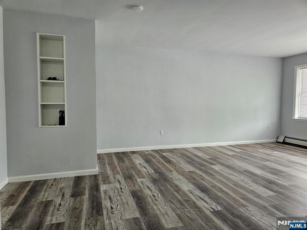 605 Grove Street, Unit F8 Clifton, NJ 07013 - Photo 3 of 15 a view of an empty room and window