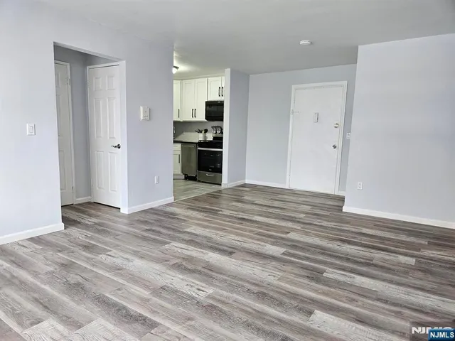 a view of kitchen and wooden floor