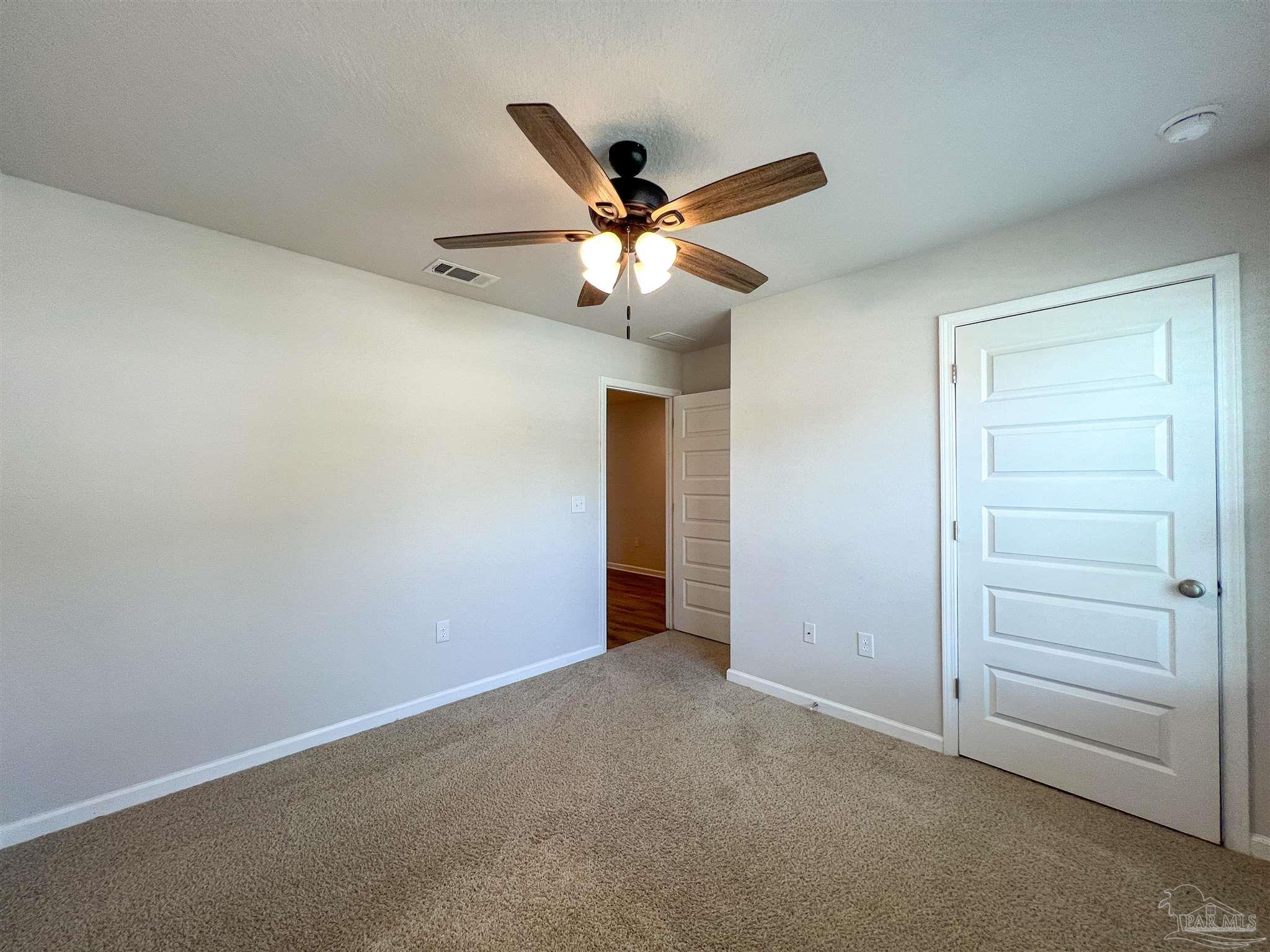 5292 Peach Drive Pace, FL 32571 - Photo 25 of 27 wooden floor in an empty room