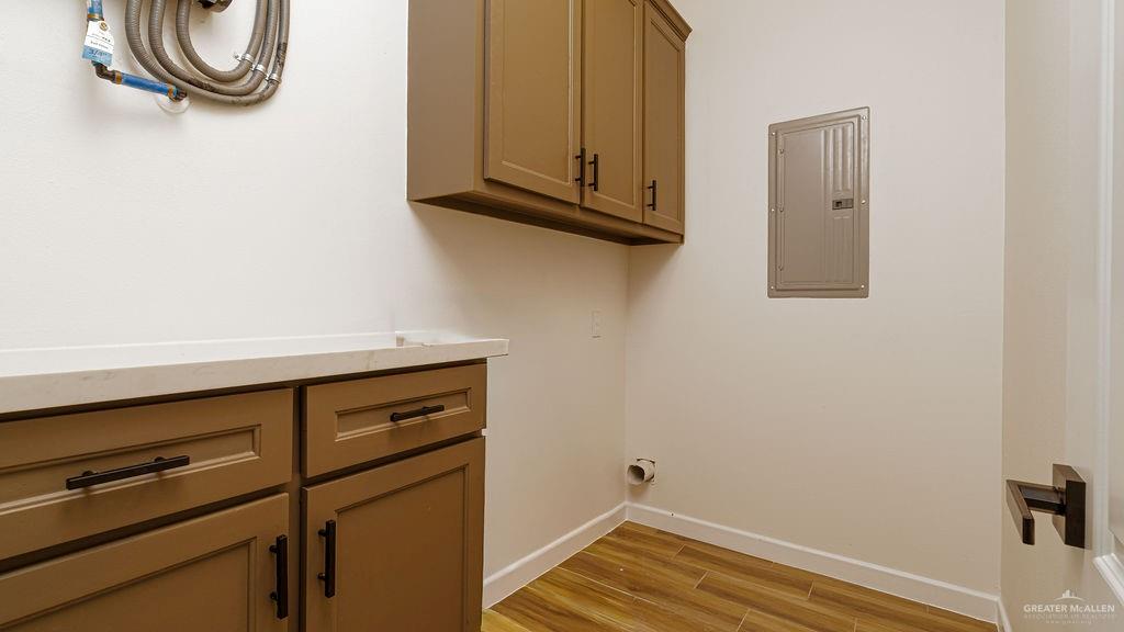 1212 East Acacia Drive East San Juan, TX 78589 - Photo 16 of 16 a view of a storage and utility room with wooden floor