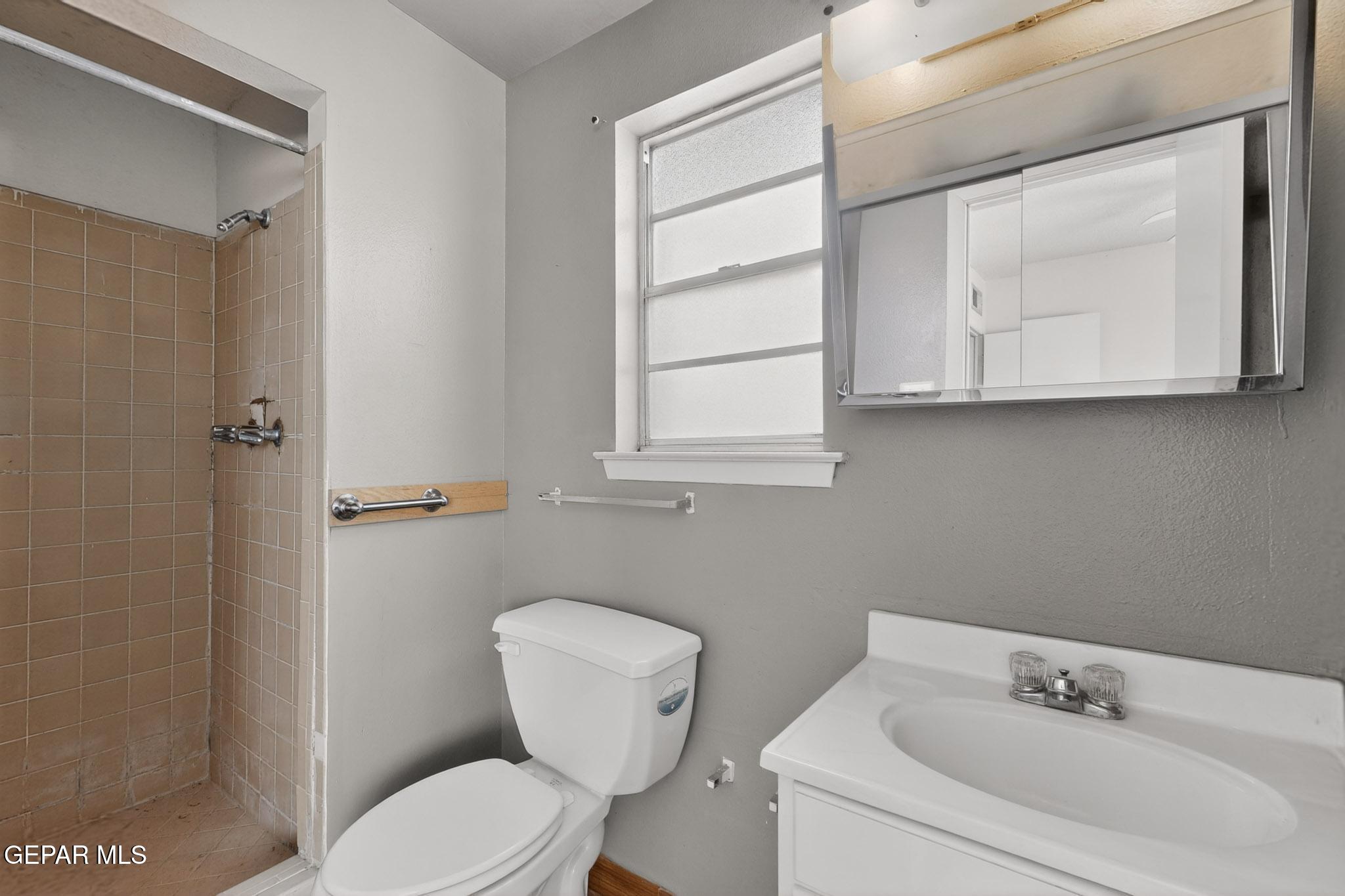 917 Marigold Way El Paso, TX 79907 - Photo 18 of 38 a white toilet sitting next to a bathroom sink