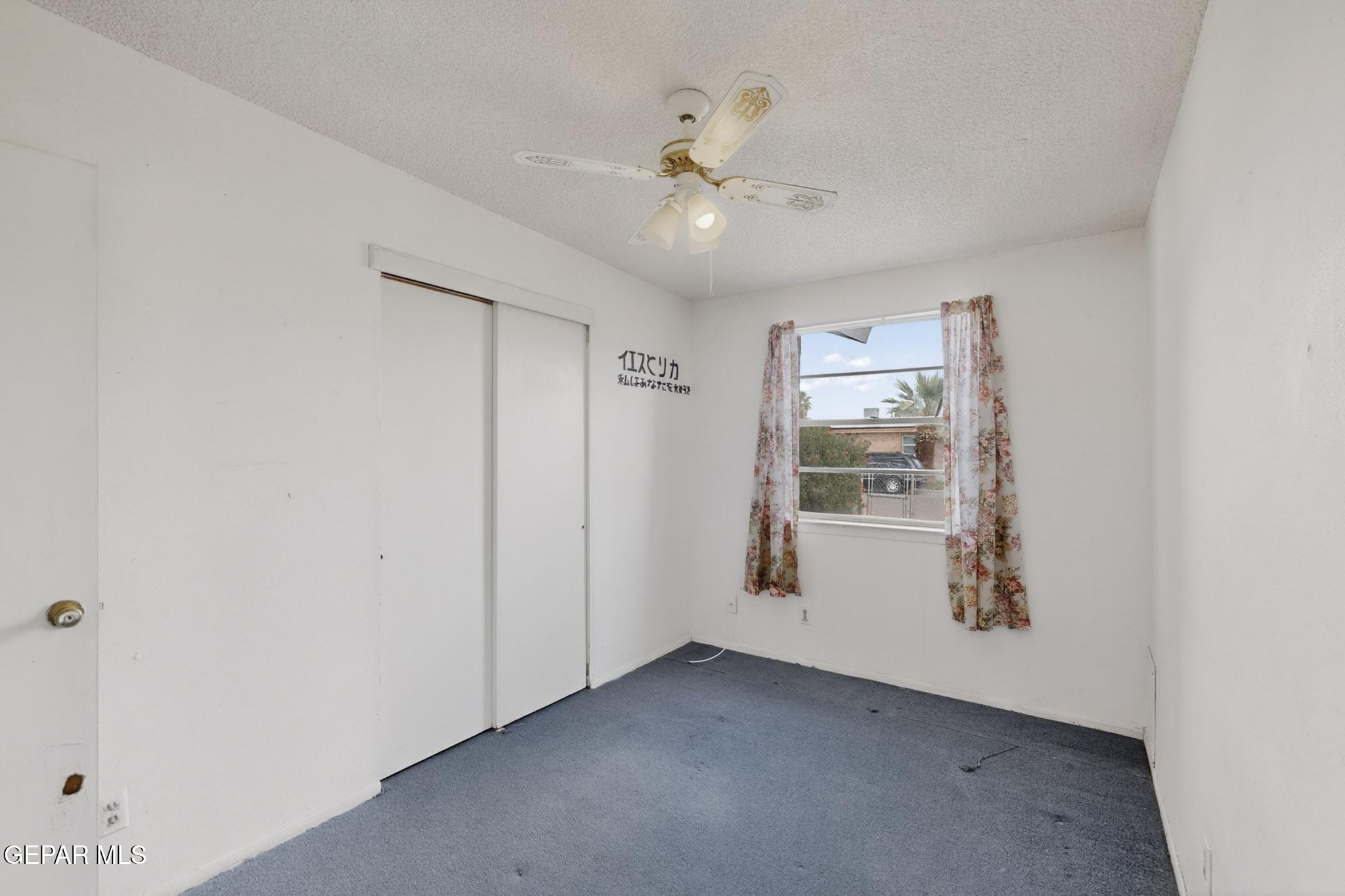 917 Marigold Way El Paso, TX 79907 - Photo 21 of 38 an empty room with fan and windows