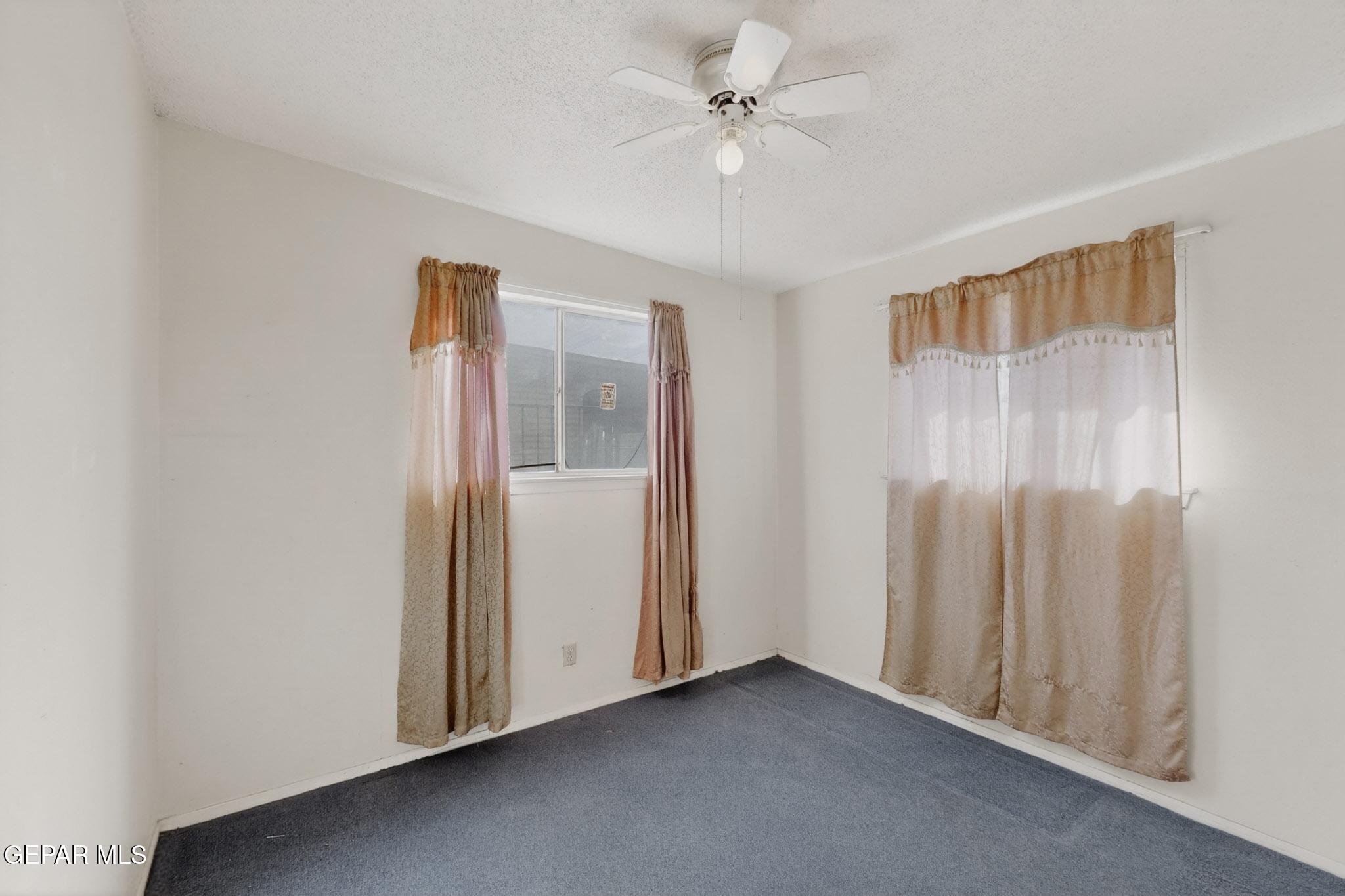 917 Marigold Way El Paso, TX 79907 - Photo 23 of 38 wooden floor in an empty room with a window