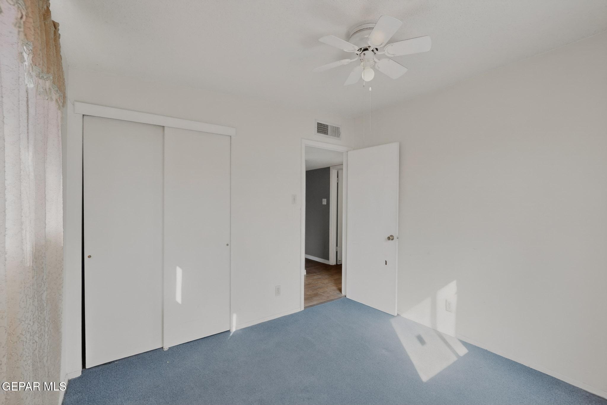 917 Marigold Way El Paso, TX 79907 - Photo 24 of 38 an empty room with a ceiling fan and a ceiling fan