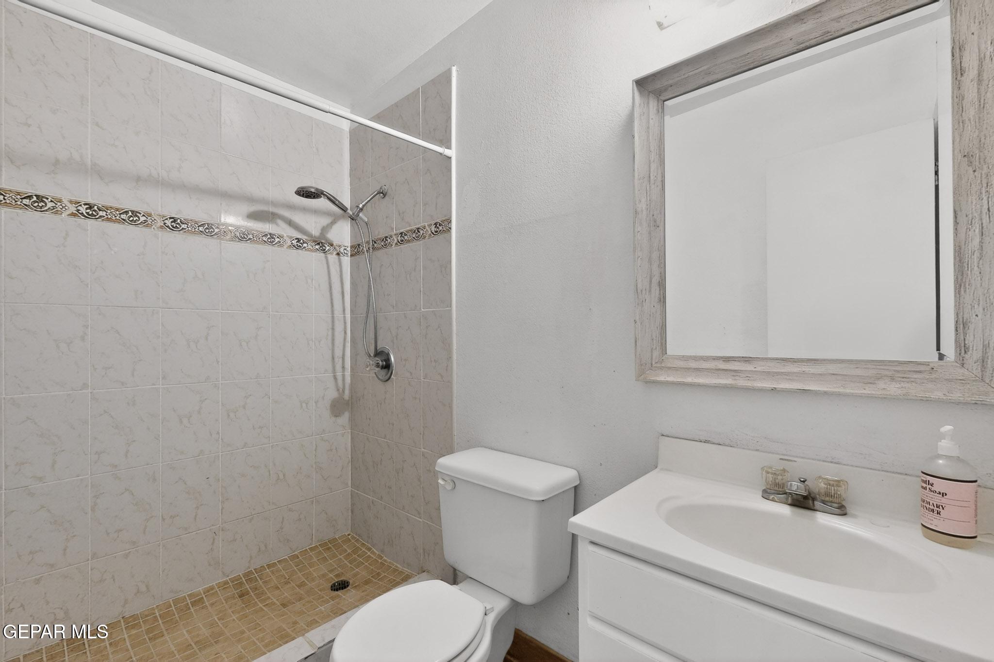 917 Marigold Way El Paso, TX 79907 - Photo 26 of 38 a bathroom with a sink toilet and shower