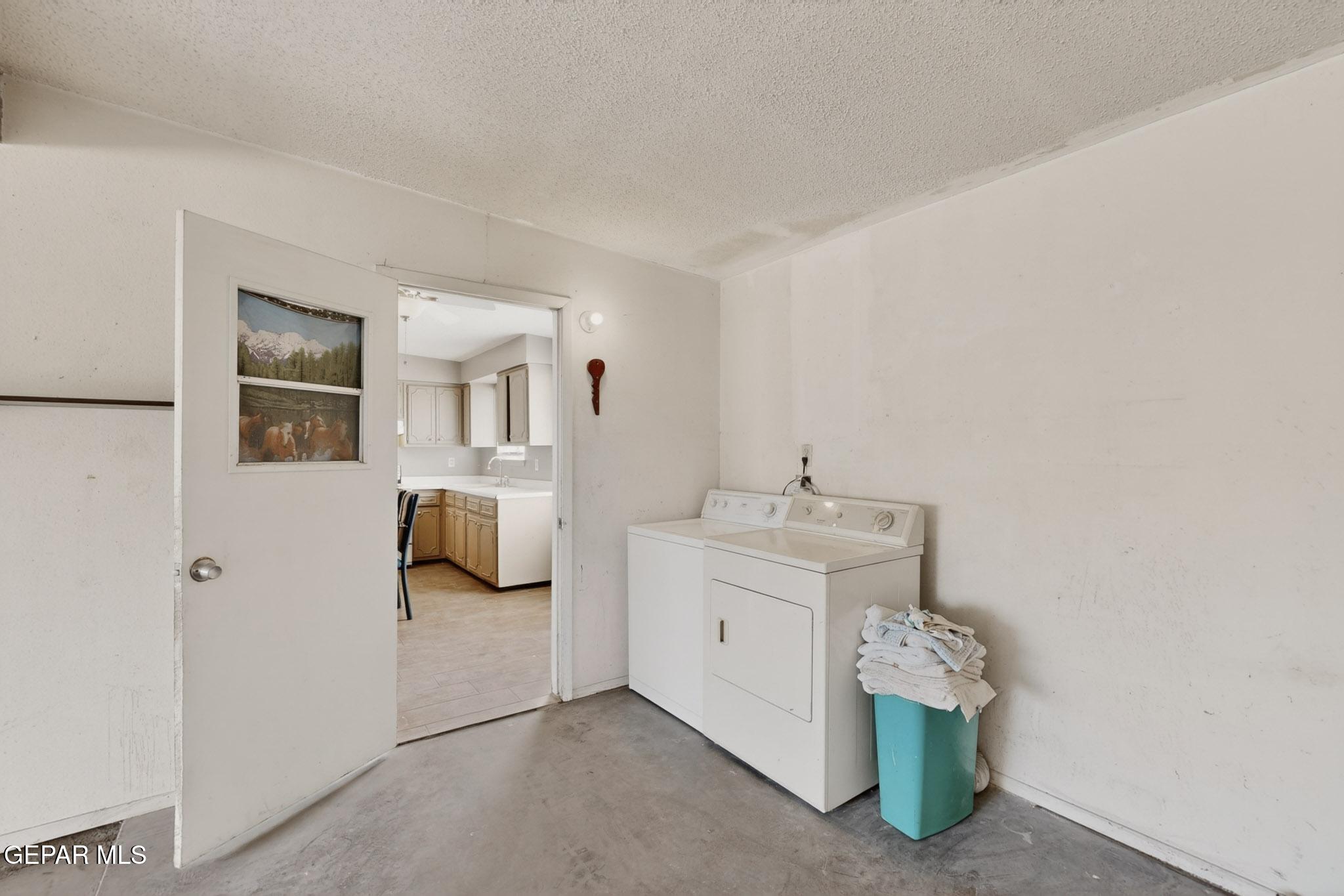 917 Marigold Way El Paso, TX 79907 - Photo 30 of 38 a bathroom with a sink and mirror with toilet
