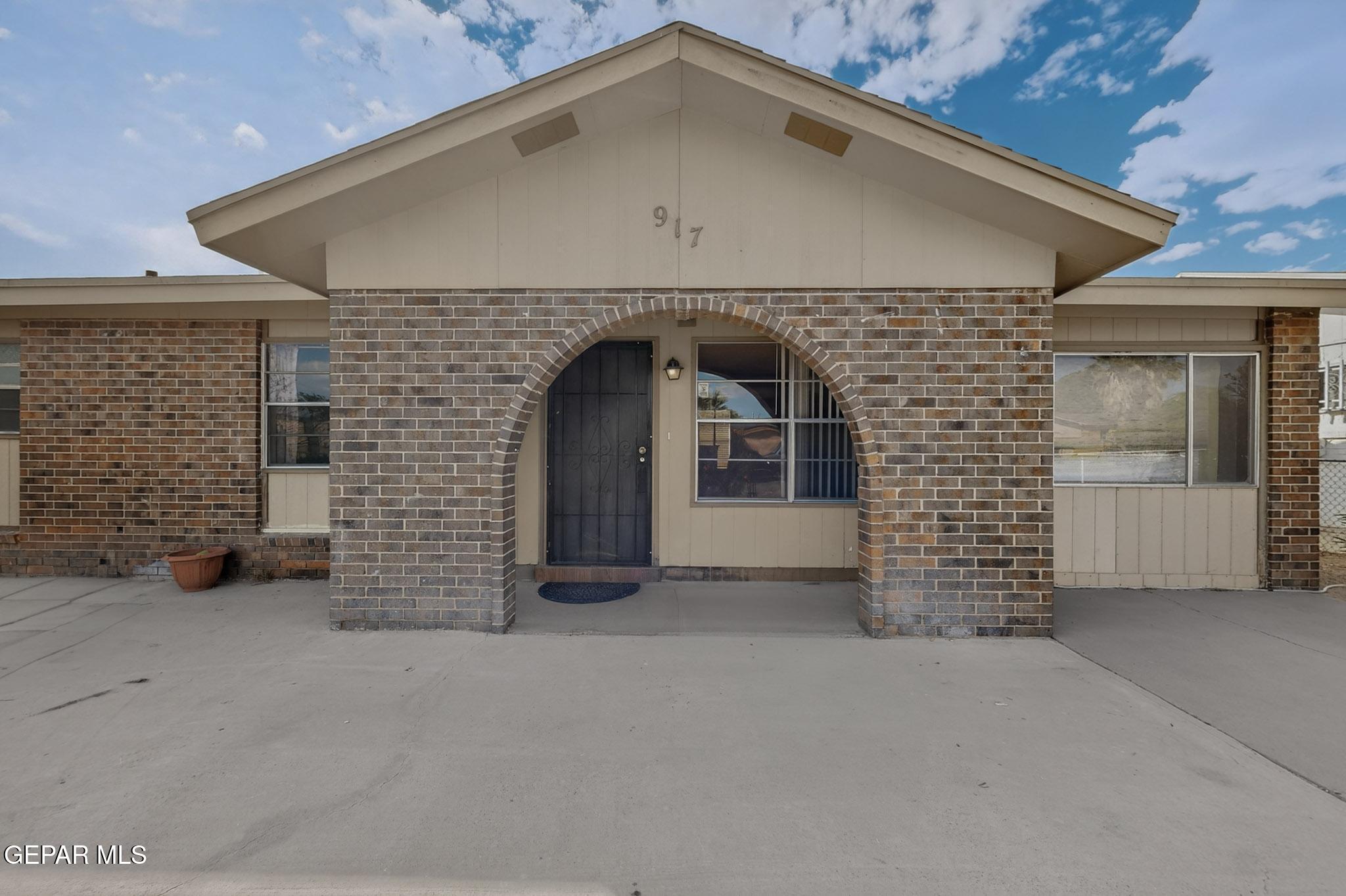 917 Marigold Way El Paso, TX 79907 - Photo 3 of 38 an entrance to house with yard