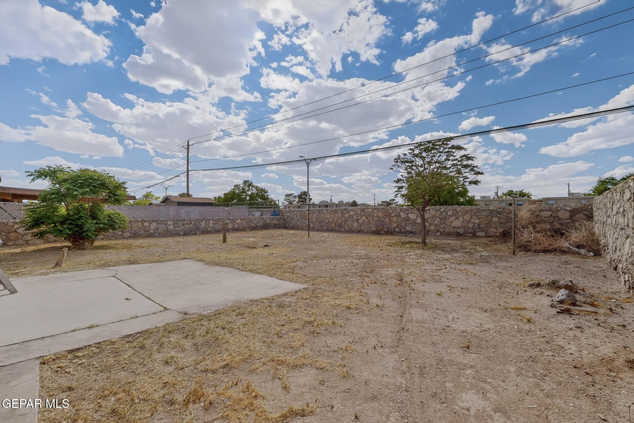 917 Marigold Way El Paso, TX 79907 - Photo 34 of 38 a view of a dry yard with wooden fence