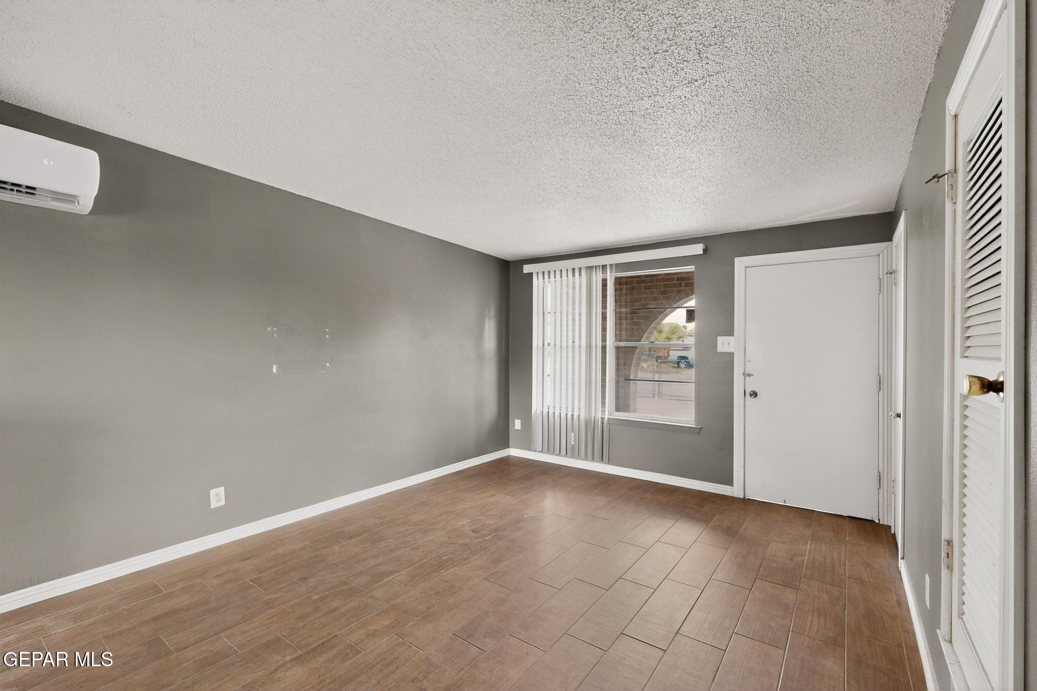 917 Marigold Way El Paso, TX 79907 - Photo 5 of 38 a view of an empty room with a window