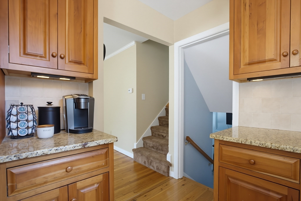 433 Pearse Road Swansea, MA 02777 - Photo 14 of 40 a kitchen with granite countertop stainless steel appliances granite countertop wooden cabinets a sink and dishwasher