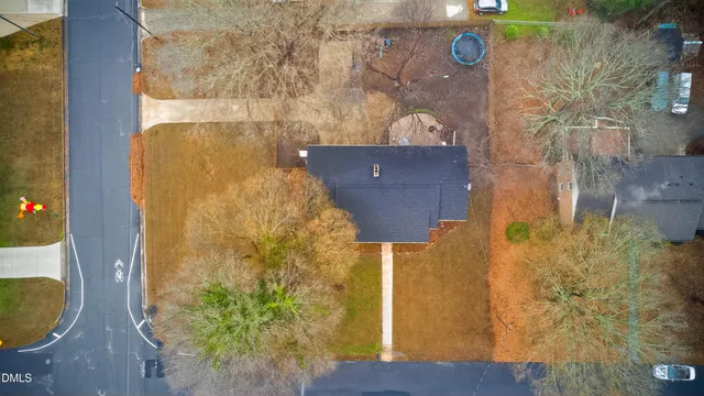 a aerial view of a house with a yard