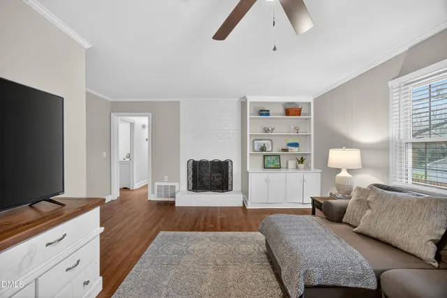 a bedroom with a large bed and a flat screen television