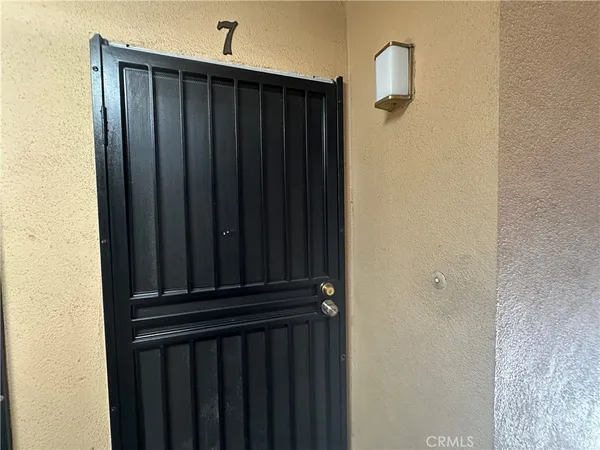 a kitchen with a sink and a stove top oven