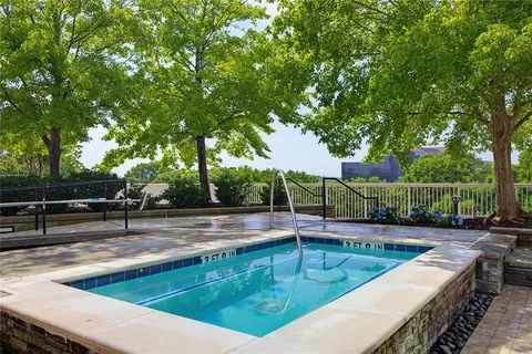 a view of a swimming pool with a patio