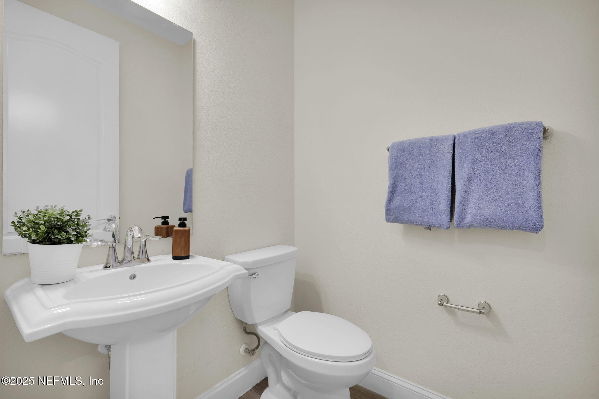 334 Clifton Bay Loop St. Johns, FL 32259 - Photo 15 of 60 a bathroom with a sink mirror and toilet
