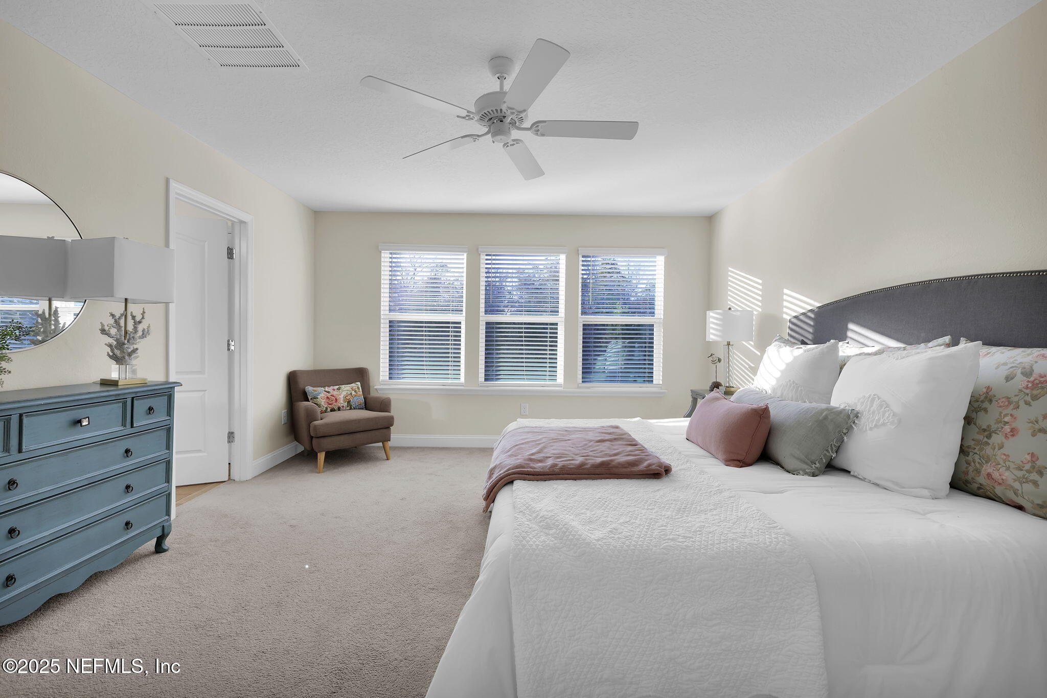 334 Clifton Bay Loop St. Johns, FL 32259 - Photo 20 of 60 a bedroom with a bed and a large window