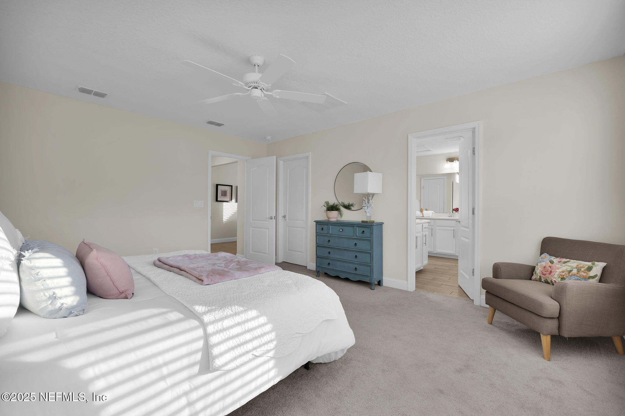 334 Clifton Bay Loop St. Johns, FL 32259 - Photo 21 of 60 a spacious bedroom with a bed and furniture