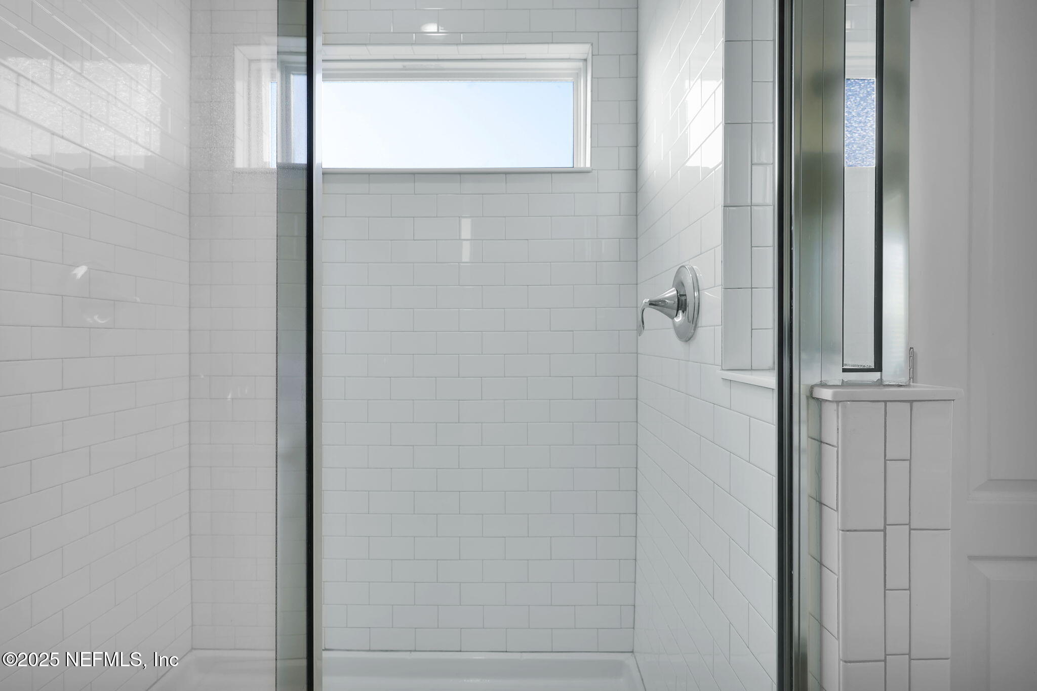 334 Clifton Bay Loop St. Johns, FL 32259 - Photo 25 of 60 a bathroom with a glass shower door