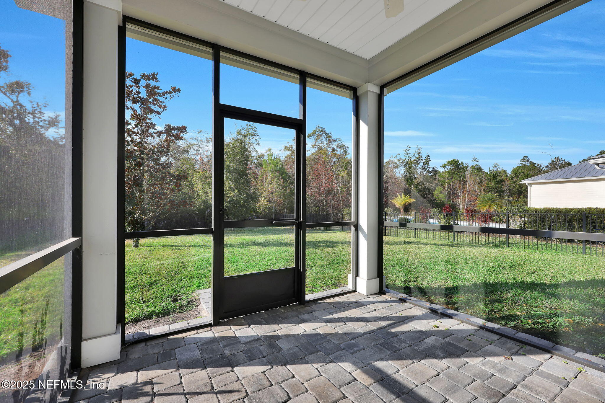 334 Clifton Bay Loop St. Johns, FL 32259 - Photo 32 of 60 a view of a porch with a floor to ceiling window and a yard