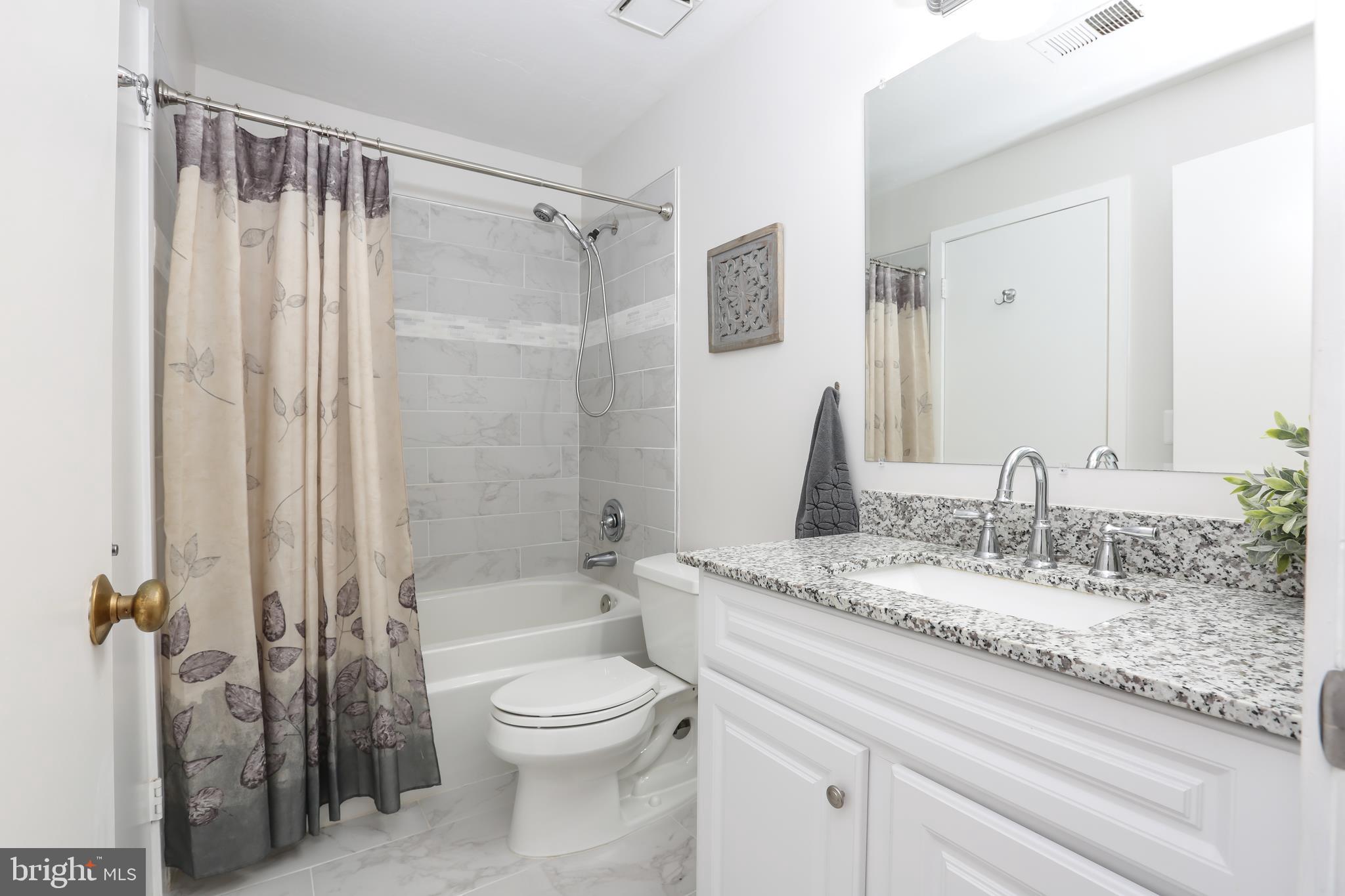 1502 Summerchase Court Reston, VA 20194 - Photo 14 of 26 Remodeled Bathroom with Gorgeous Tile & Vanity