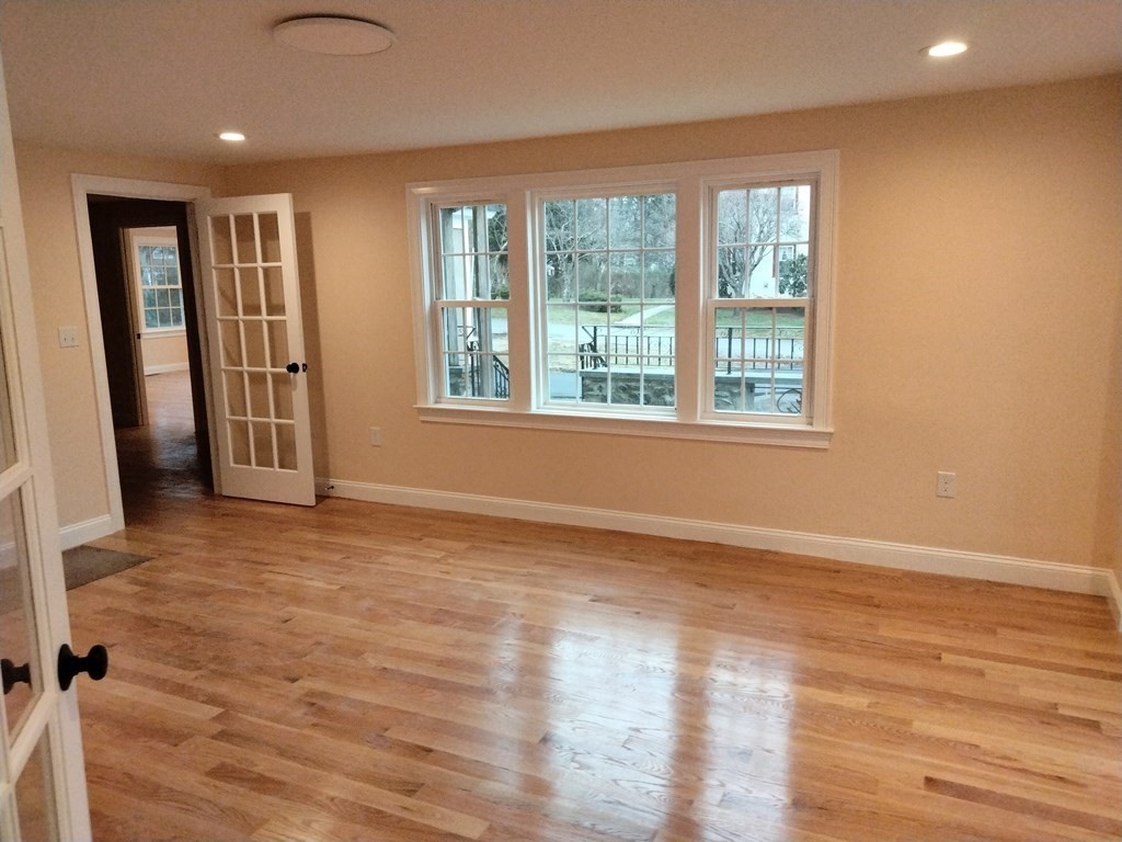 26 Woodleigh Road Dedham, MA 02026 - Photo 16 of 35 an empty room with wooden floor and windows