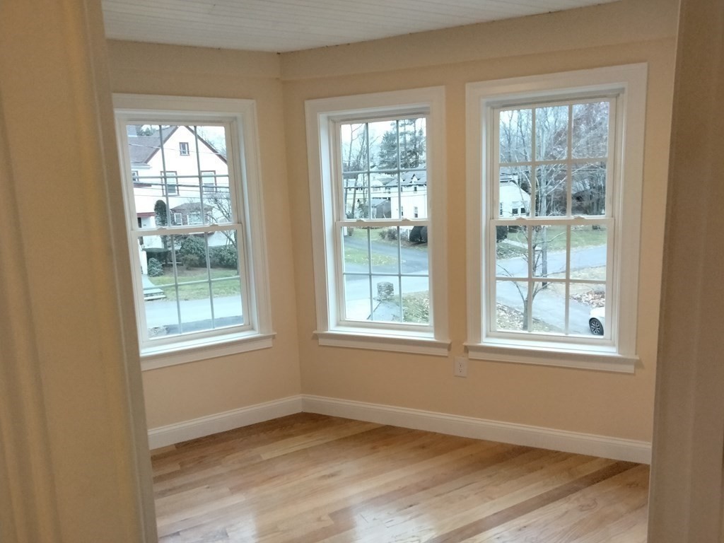 26 Woodleigh Road Dedham, MA 02026 - Photo 23 of 35 an empty room with wooden floor and windows