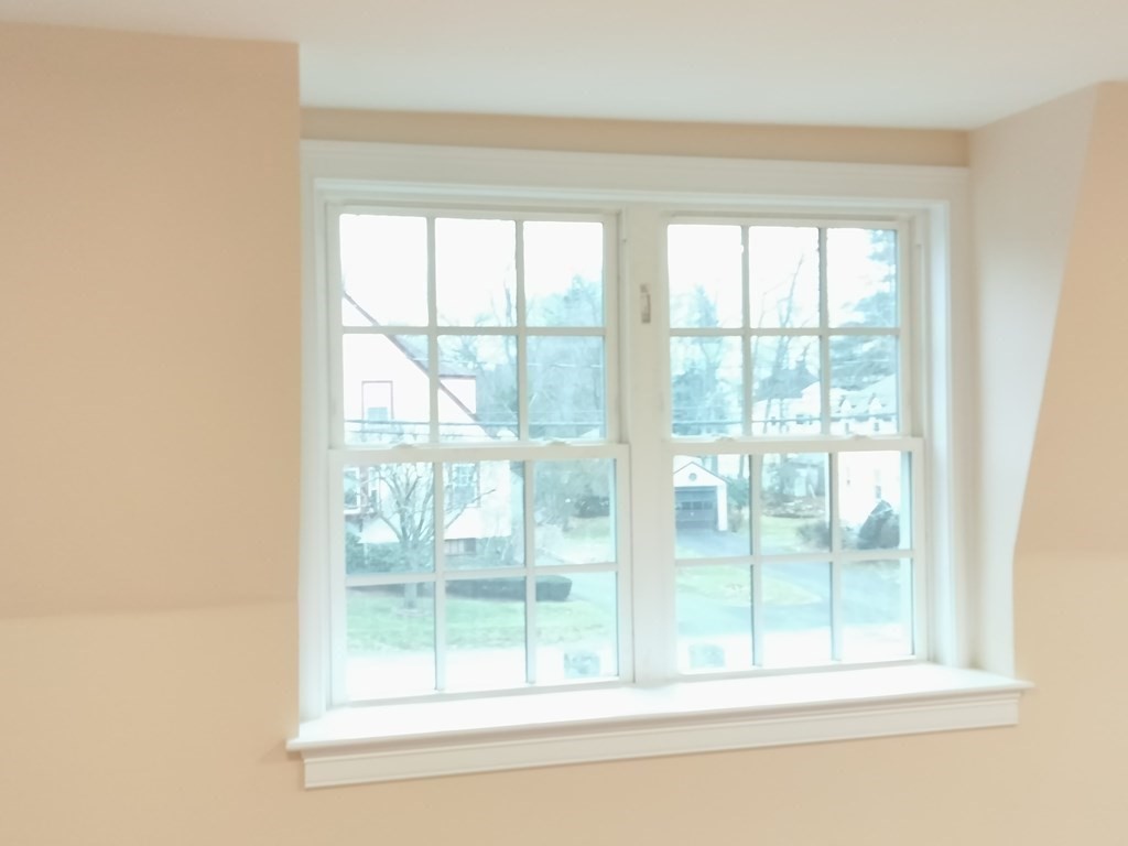 26 Woodleigh Road Dedham, MA 02026 - Photo 25 of 35 a view of a glass door with a yard