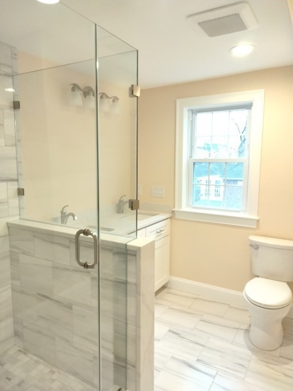 26 Woodleigh Road Dedham, MA 02026 - Photo 30 of 35 a bathroom with a toilet and a shower