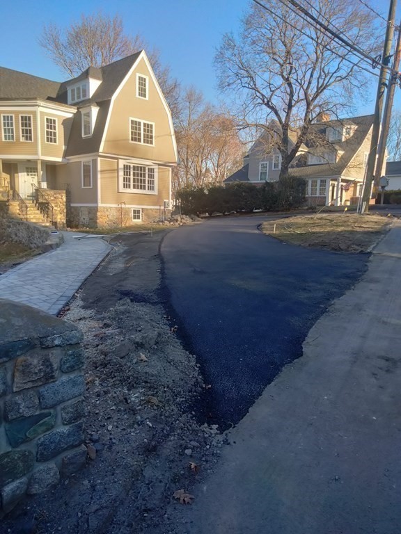 26 Woodleigh Road Dedham, MA 02026 - Photo 3 of 35 a front view of a house with a yard