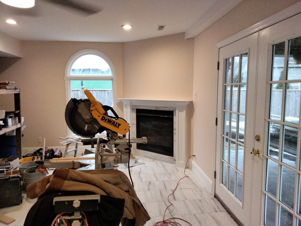 26 Woodleigh Road Dedham, MA 02026 - Photo 35 of 35 a view of a livingroom with furniture and front door