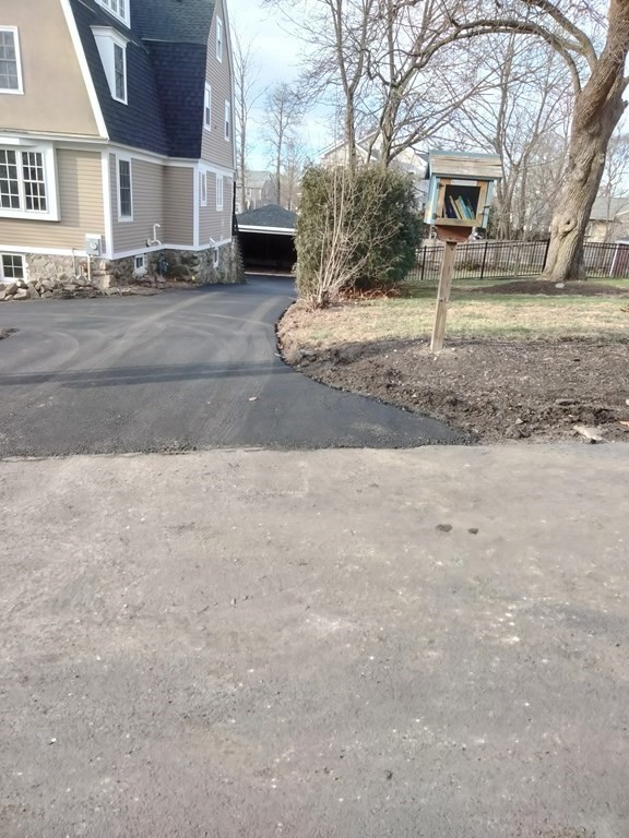 26 Woodleigh Road Dedham, MA 02026 - Photo 4 of 35 a front view of a house with a yard