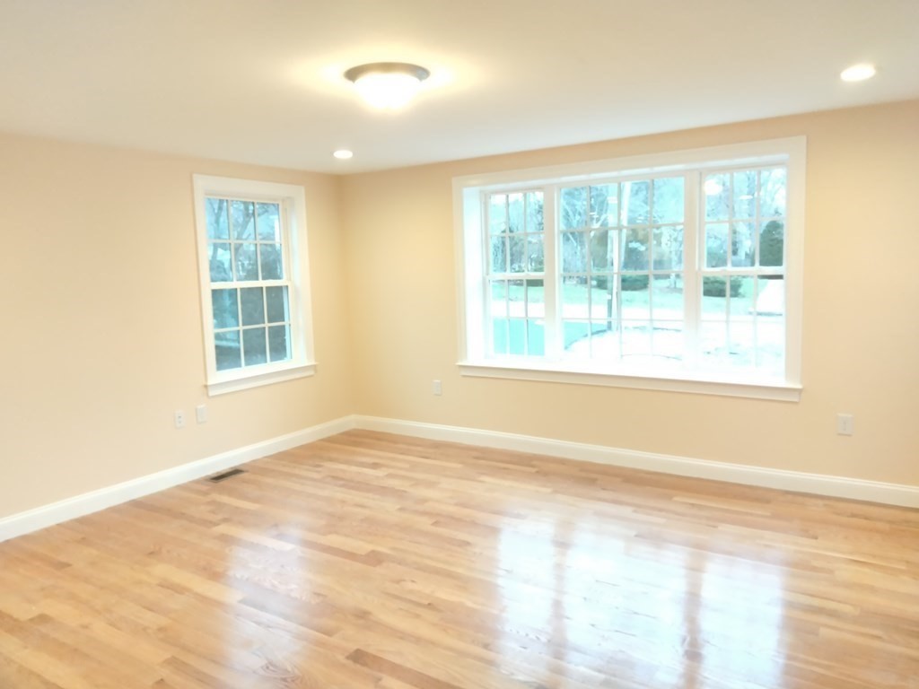 26 Woodleigh Road Dedham, MA 02026 - Photo 6 of 35 a view of an empty room with a window