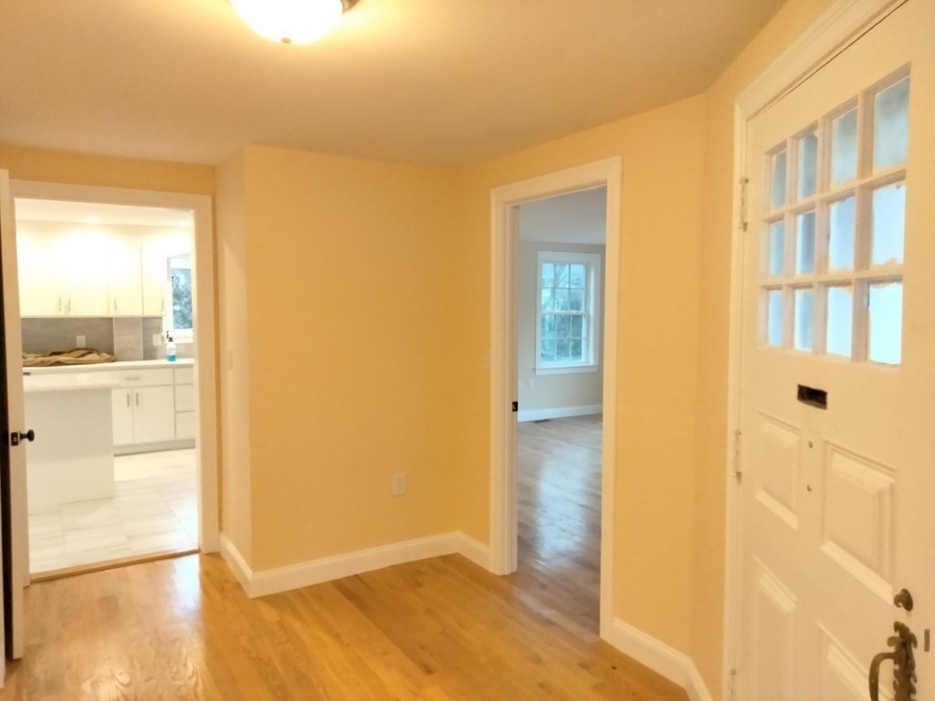 26 Woodleigh Road Dedham, MA 02026 - Photo 10 of 35 a view of a bathroom with a shower and a door