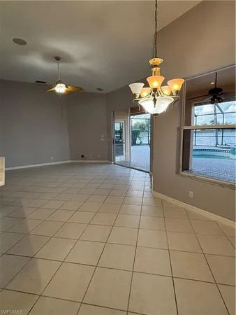 a view of a room with windows and chandelier